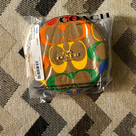 Coach Handbags - Coach Round Coin Case In Rainbow Signature Canvas